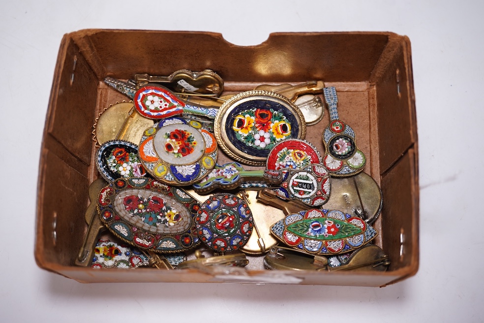 A collection of twenty-eight brooches, including fourteen mixed guitar and banjo shaped brooches, six large oval brooches, seven smaller brooches and one small oval., Condition - good